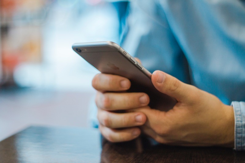 man holding iPhone